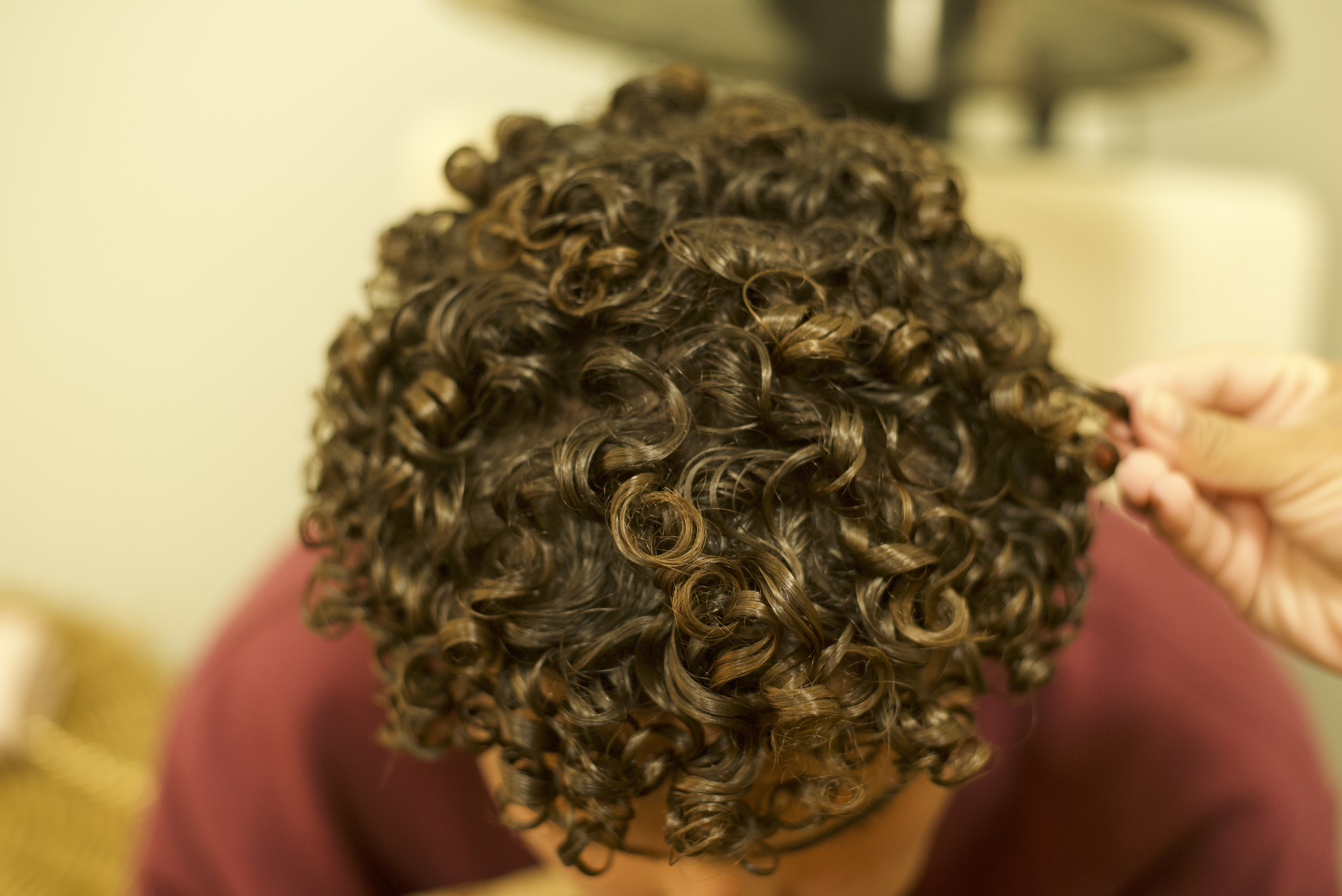 Client showing how his hair turned out, super curly